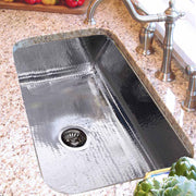 Nantucket Sinks KSSH3219-10 close view installed in granite with a basket strainer