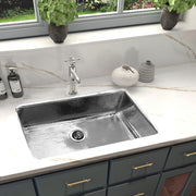 Nantucket Sinks KSSH3219-10 installed in a white marble counter with a bridge faucet