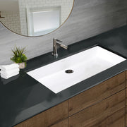 Nantucket Sinks NS-GSTR36 white 36" sink undermounted in a dark counter over a wood vanity