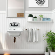 Nantucket Sinks NS-VC16-WW-MBFCT wall-mount sink with matte black faucet on white beadboard with towels