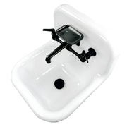 Nantucket Sinks NS-VC16-WW-MBFCT wall-mount sink from above at an angle, black faucet, soap dish and drain