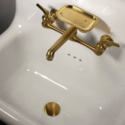 Nantucket Sinks NS-VC16-WW-SBFCT close-up into the bowl showing the brass faucet and brass drain
