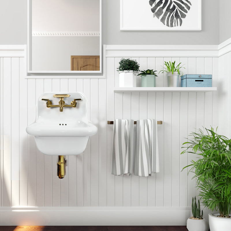 Nantucket Sinks NS-VC16-WW-SBFCT wall-mount sink with brass faucet on white beadboard with towels