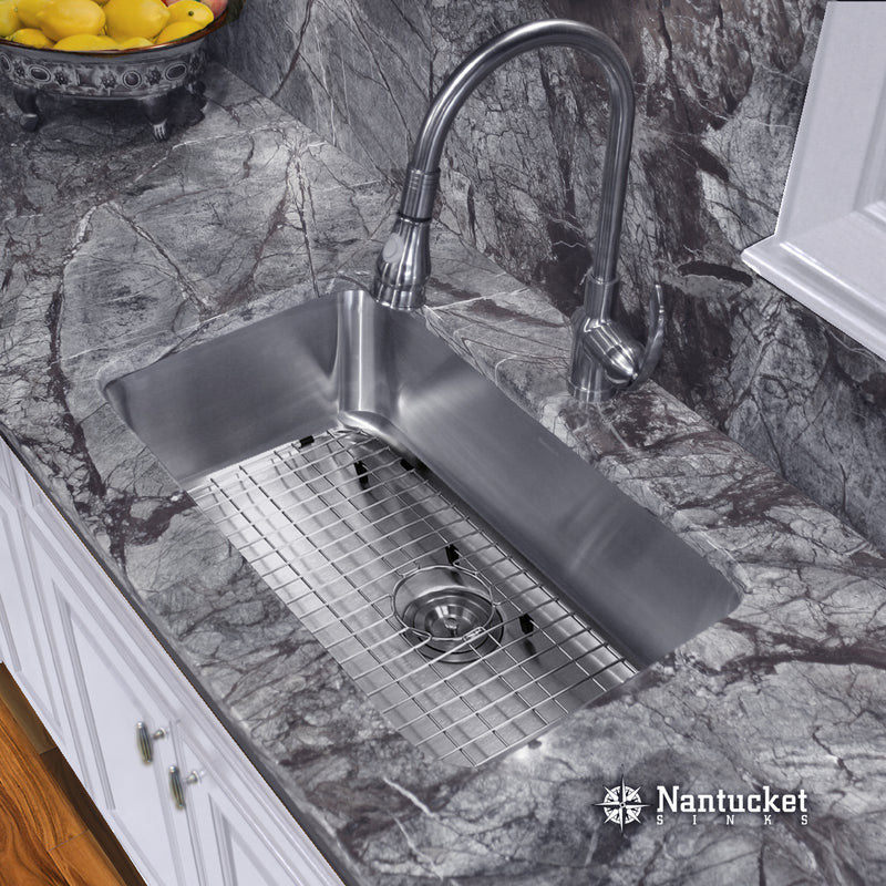 Nantucket Sinks NS3018-9-16 installed in gray stone with grid and pull-down faucet