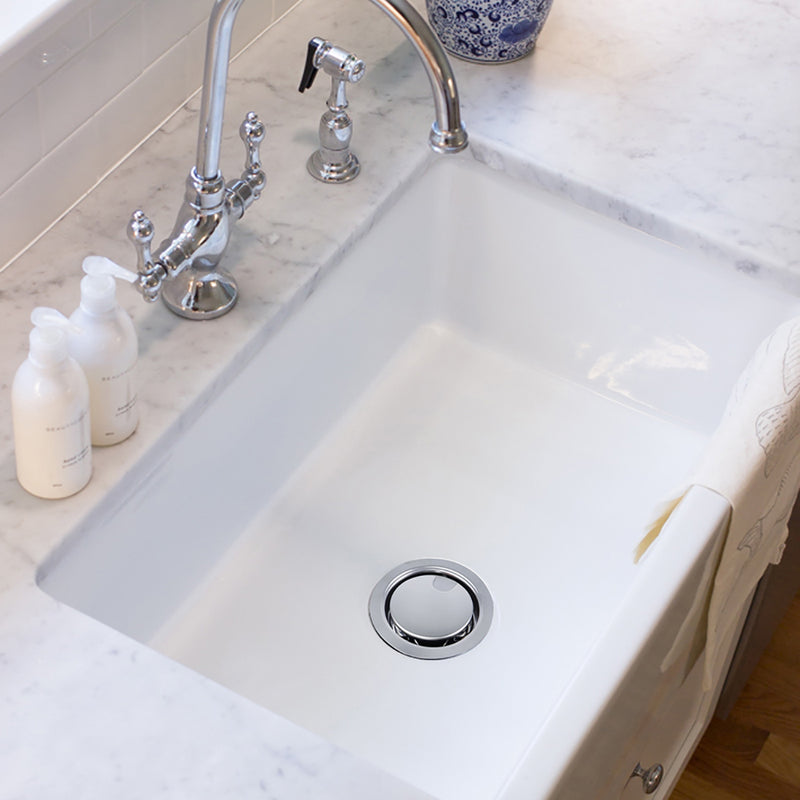 Nantucket Sinks NS35LCC-CH chrome crumb cup drain in a white undermount sink with a chrome bridge faucet