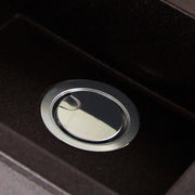Nantucket Sinks NS35LCC-CH chrome crumb cup drain closed in a dark granite composite sink