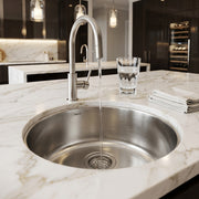 Nantucket Sinks NS37 installed in a white marble island with a pull-down faucet