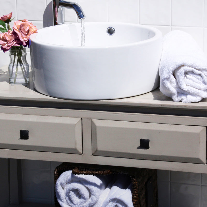 Nantucket Sinks NSV213 white round vessel sink on a gray console vanity with towels