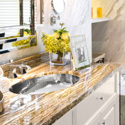 Nantucket Sinks OVS installed in a gold-veined stone vanity with a chrome faucet