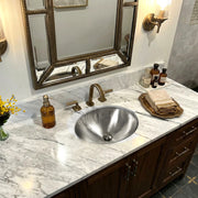 Nantucket Sinks OVS2017 installed in a marble vanity under a framed mirror