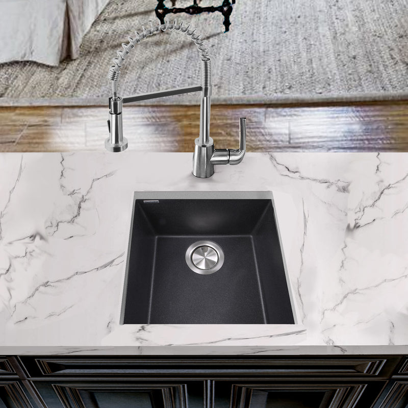 Nantucket Sinks PR1716-BL black bar sink undermounted in a white marble counter with a pull-down faucet