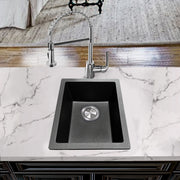 Nantucket Sinks PR1815-BL black bar sink undermounted in a white marble counter with a pull-down faucet