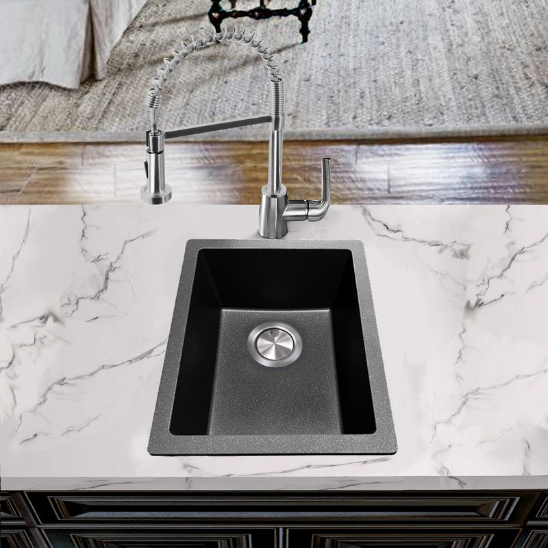 Nantucket Sinks PR1815-BL black bar sink undermounted in a white marble counter with a pull-down faucet