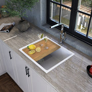 Nantucket Sinks PR2219PS-W white workstation sink in a stone counter with the cutting board on the ledge