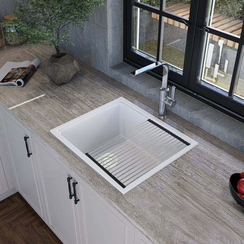 Nantucket Sinks PR2219PS-W white workstation sink in a stone counter with the roll-up mat in place