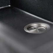 Nantucket Sinks PR3018-BL close-up of the stainless drain and black flecked granite bowl floor