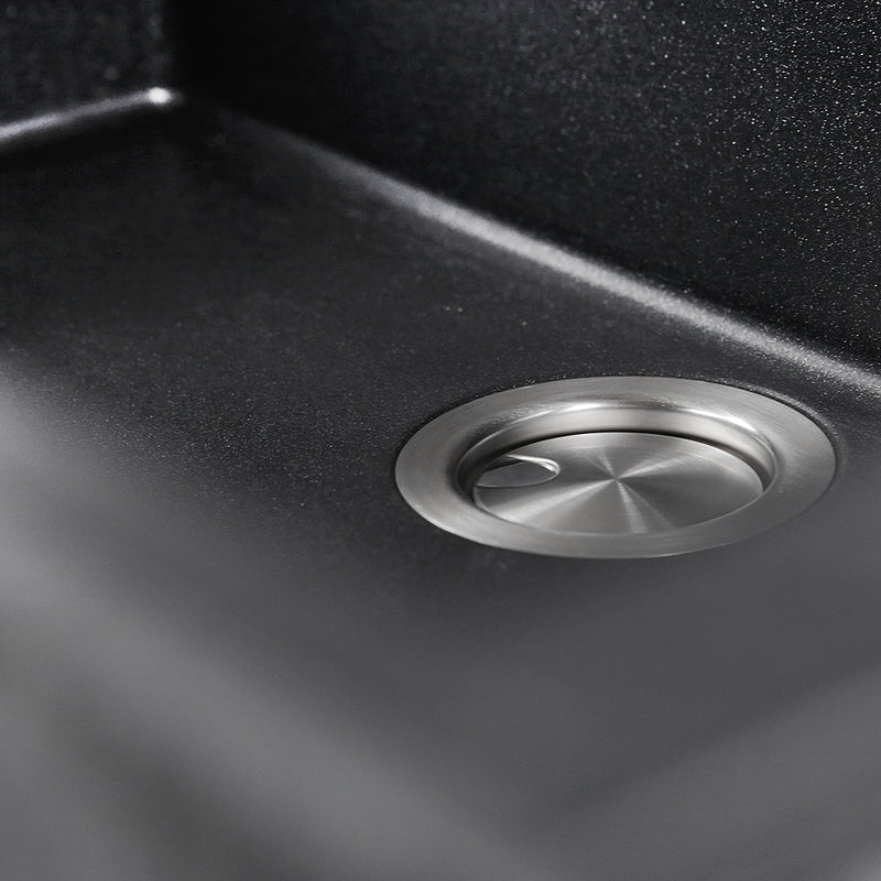 Nantucket Sinks PR3018-BL close-up of the stainless drain and black flecked granite bowl floor