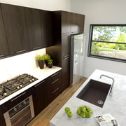 Nantucket Sinks PR3018-BR brown single-bowl sink undermounted in a marble kitchen island