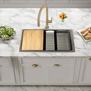 Nantucket Sinks PR3019PS-TI titanium workstation sink in a marble counter with board and colanders