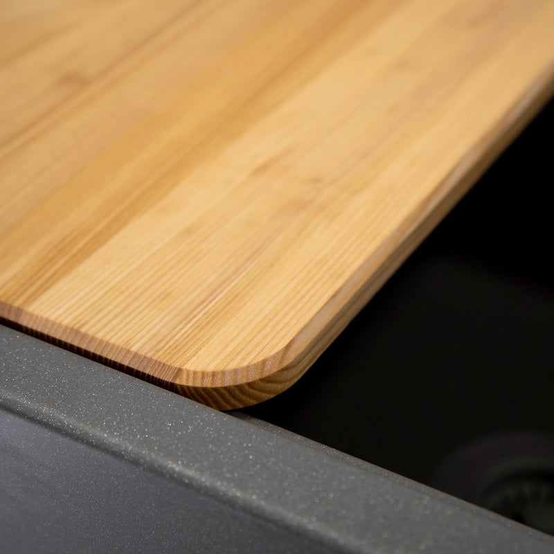 Nantucket Sinks PR3020-APS-TI close-up of the cutting board edge resting on the titanium sink's ledge
