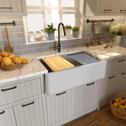 Nantucket Sinks PR3320-APS-G light grey apron workstation sink in a marble counter with board and mat