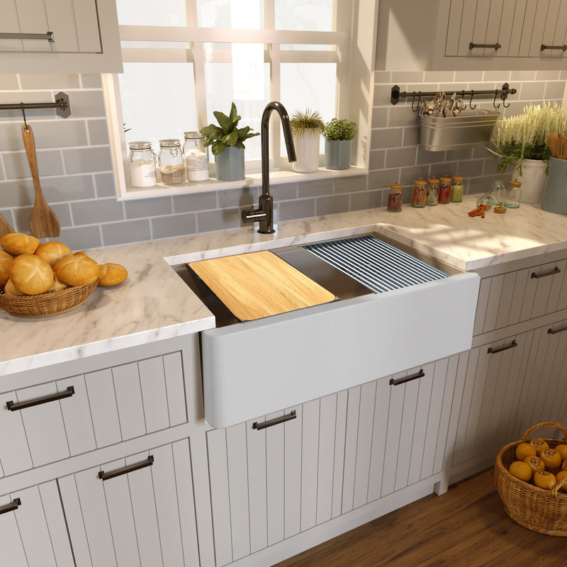 Nantucket Sinks PR3320-APS-G light grey apron workstation sink in a marble counter with board and mat