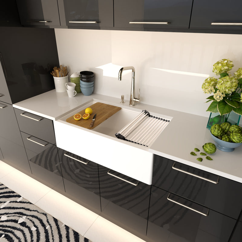 Nantucket Sinks PR3320-APS-W white apron workstation sink in a glossy black kitchen
