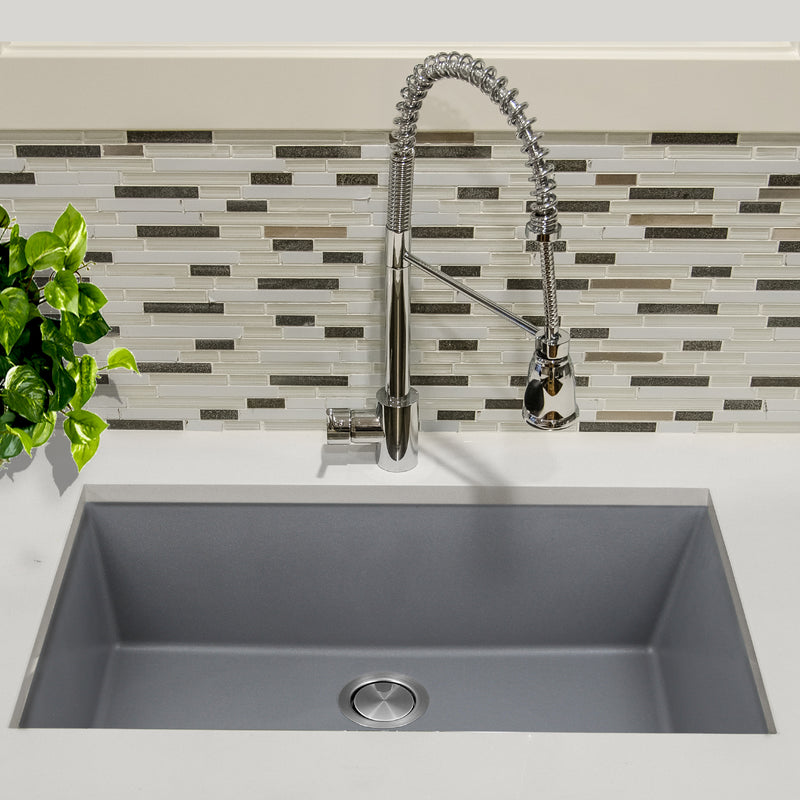 Nantucket Sinks PR3320-TI-UM titanium sink undermounted in a white counter with a spring pull-down faucet