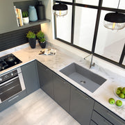 Nantucket Sinks PR3320-TI-UM titanium sink undermounted in a white marble corner counter