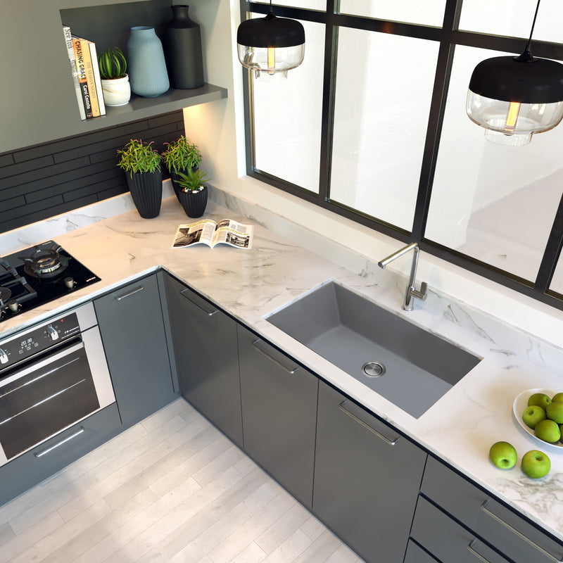 Nantucket Sinks PR3320-TI-UM titanium sink undermounted in a white marble corner counter