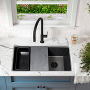 Nantucket Sinks PR3322PS-BL black workstation sink under a window with a matte black faucet