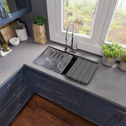 Nantucket Sinks PR3419-NBL-UM black workstation sink with board and mat in a gray corner counter