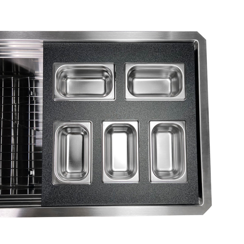 Nantucket Sinks PS20B-REC5 five-bin tray resting across the ledges of a stainless prep station sink