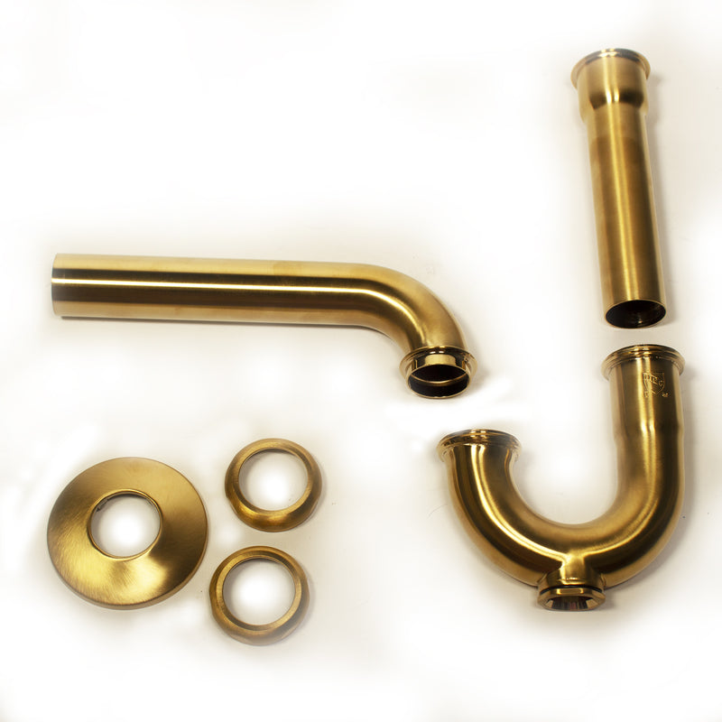 Nantucket Sinks PT-SB satin brass P-trap parts laid out: trap, wall arm, tailpipe, escutcheon and slip nuts