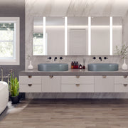 Nantucket Sinks RC5022C two Matte Concrete oval vessel sinks on a floating vanity with lit mirrors