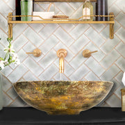 Nantucket Sinks RC7040GMS-MB Drake gold leaf vessel sink below a brass wall faucet and tiled wall