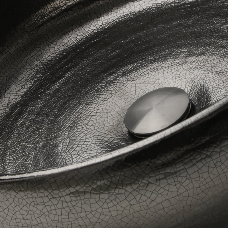 Nantucket Sinks RC72030P close-up of the crackled platinum leaf glaze around the drain cap