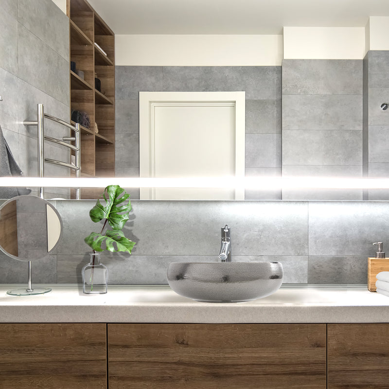 Nantucket Sinks RC72030P Monte Carlo platinum vessel sink on a wood vanity in a grey bathroom