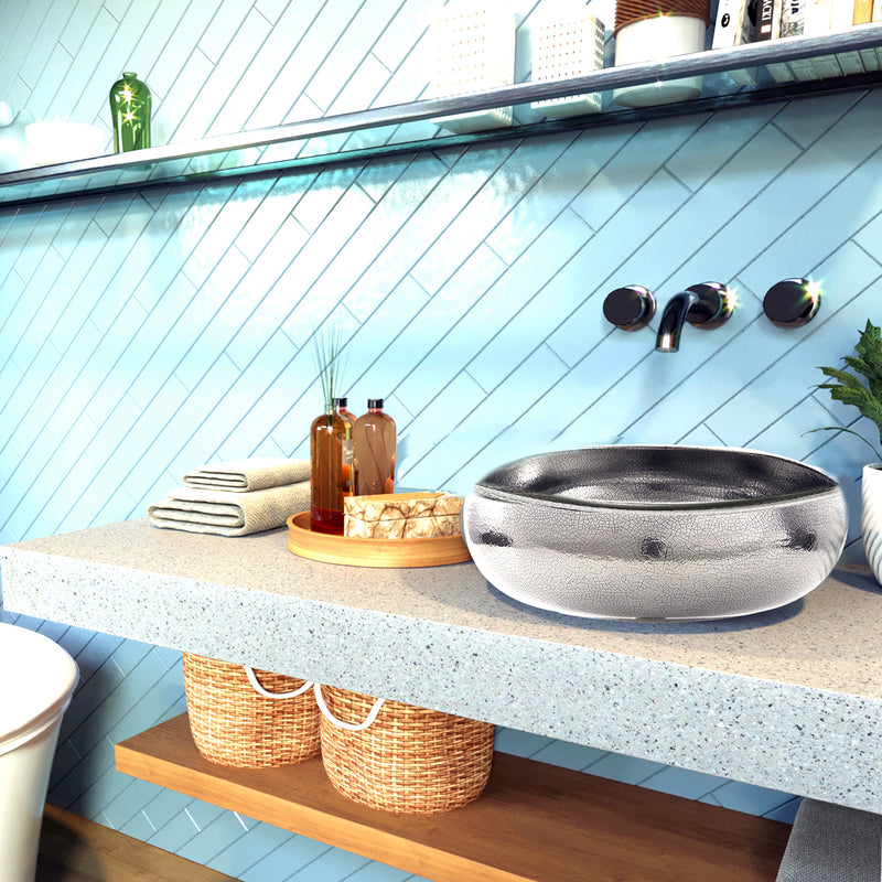 Nantucket Sinks RC72030P Monte Carlo platinum vessel sink on a terrazzo shelf against blue tile