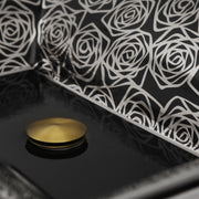 Nantucket Sinks RC73040PR close-up of the platinum rose outlines on black glaze beside the drain cap