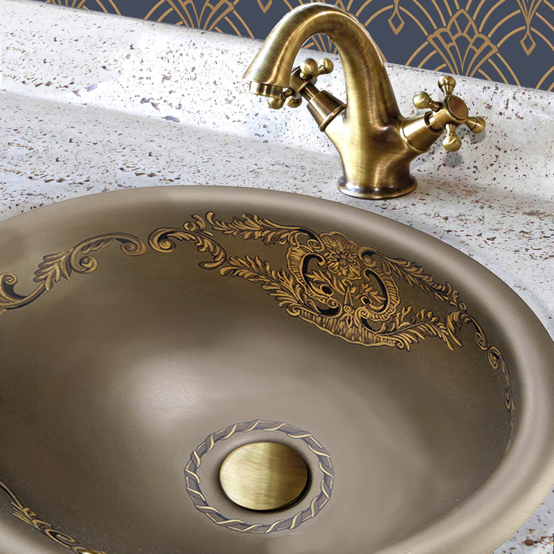 Nantucket Sinks RC73240BHY St. Louis drop-in sink in a stone counter with an antique brass faucet