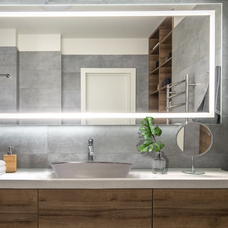 Nantucket Sinks RC77240P St. Malo platinum vessel sink on a wood vanity under a lit mirror