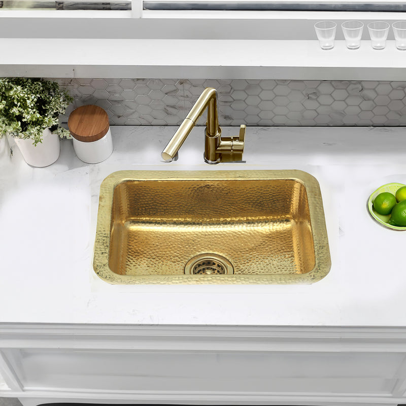 Nantucket Sinks REB2014 hammered brass sink in a white counter with a brass faucet, top view