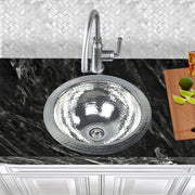 Nantucket Sinks ROS installed in black granite with a gooseneck bar faucet