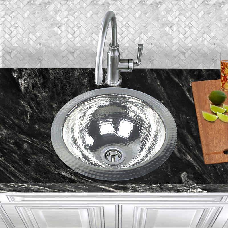 Nantucket Sinks ROS installed in black granite with a gooseneck bar faucet