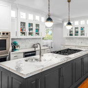 Nantucket Sinks ROS installed in a white marble island in a white kitchen