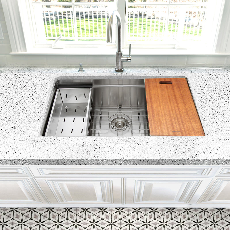 Nantucket Sinks SR-PS2-2818-16 installed in a speckled counter with colander and board on the ledge