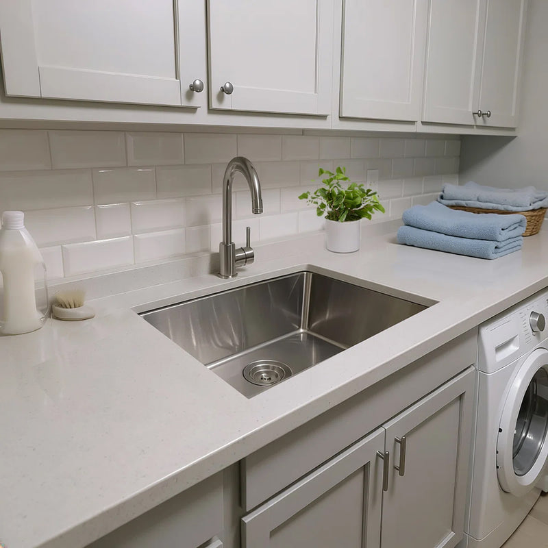 Nantucket Sinks SR2318-12-16 installed in a white laundry counter beside a washer