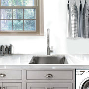 Nantucket Sinks SR2318-12-16 installed in a gray laundry room under a window
