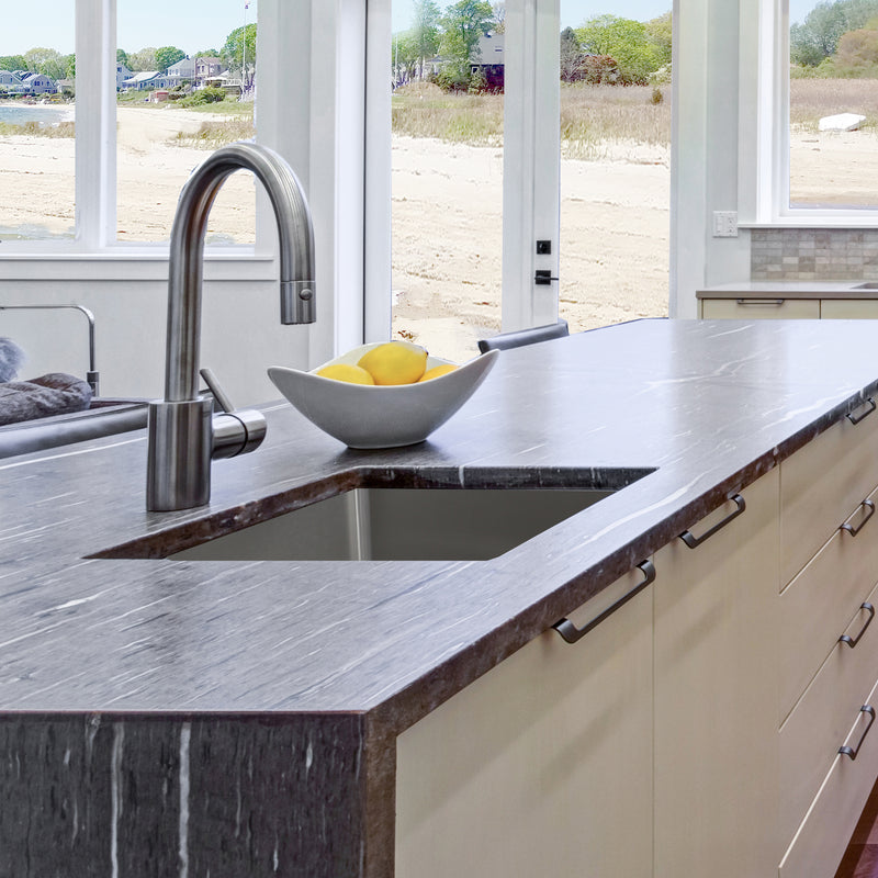 Nantucket Sinks SR2318-16 installed in a dark stone island with a bar faucet